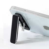Folding portable phone holder.
