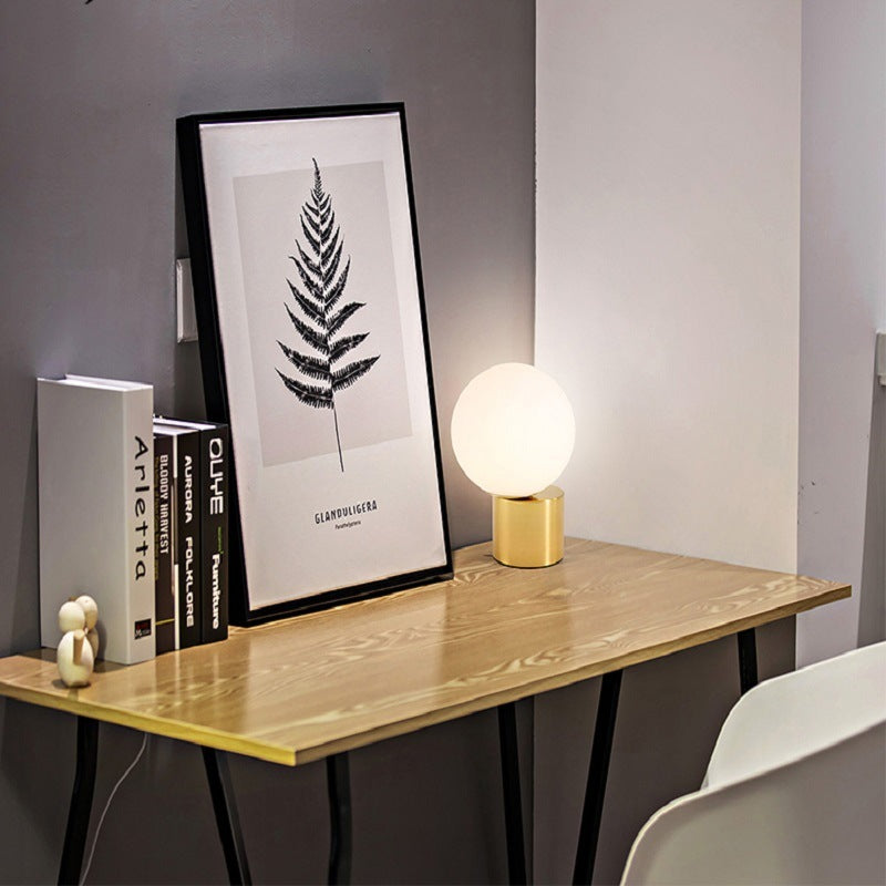 Modern Nordic glass bedside lamp.
