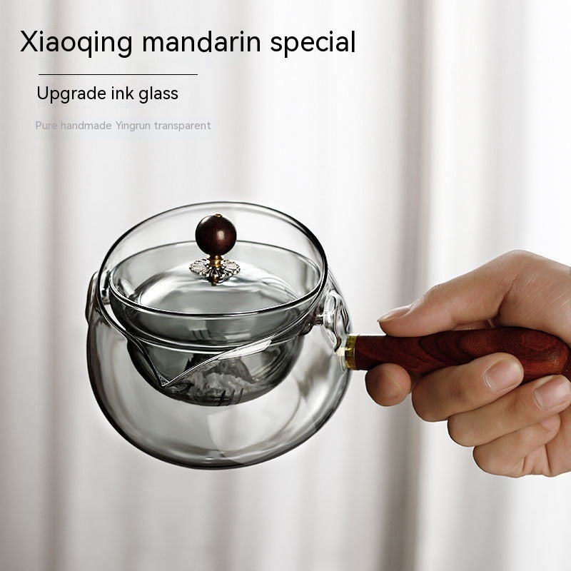 Rotary glass teapot with infuser.