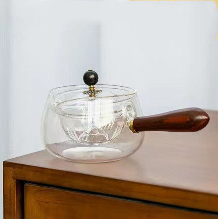 Rotary glass teapot with infuser.