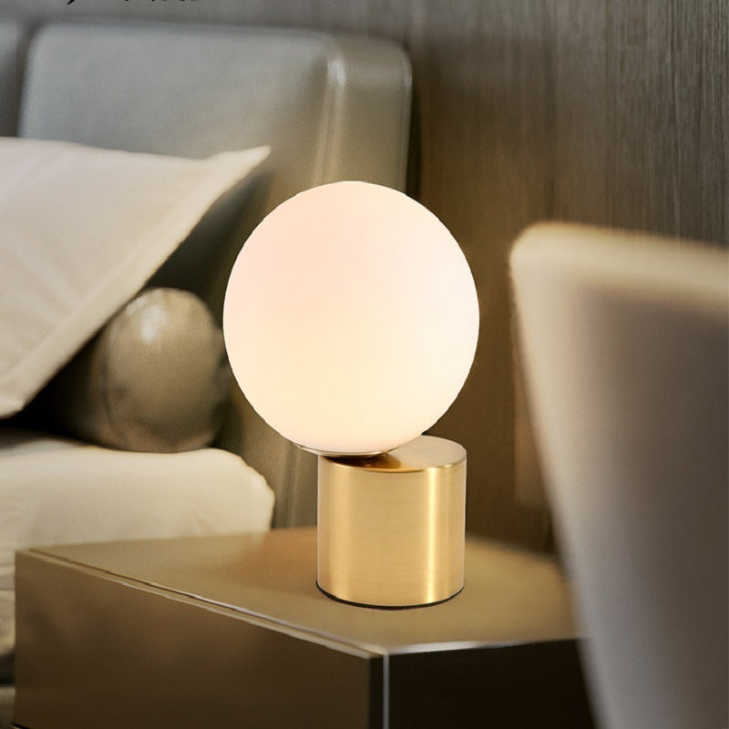 Modern Nordic glass bedside lamp.