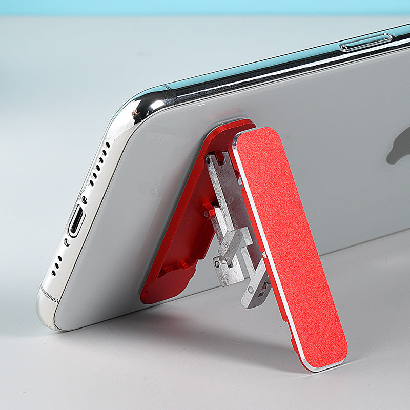 Folding portable phone holder.