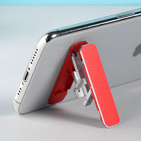 Folding portable phone holder.