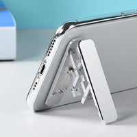 Folding portable phone holder.