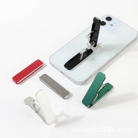 Folding portable phone holder.