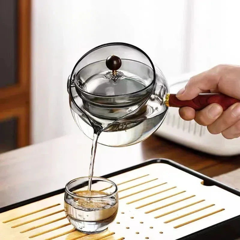 Rotary glass teapot with infuser.