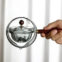 Rotary glass teapot with infuser.